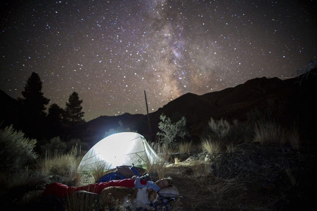 The benefits of nature travel include sleeping under the stars. 