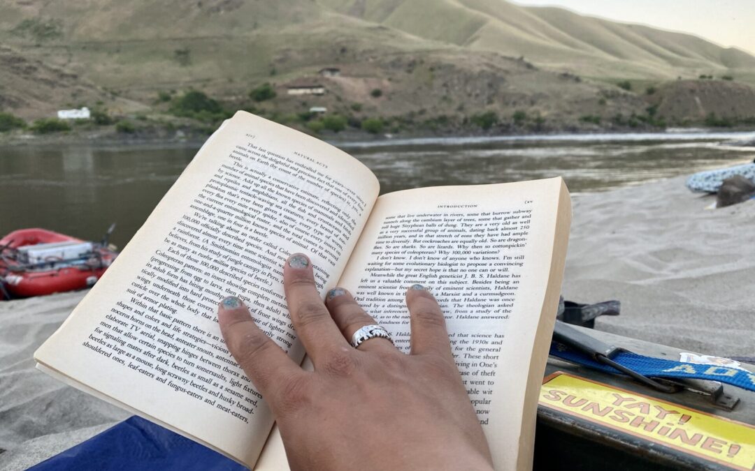 reading Natural Acts on the river