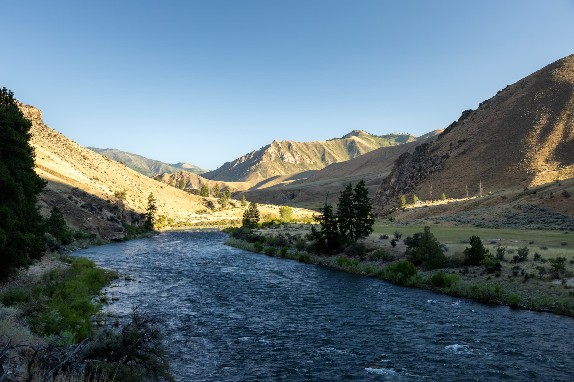 Wide open spaces on the river at sunset. 